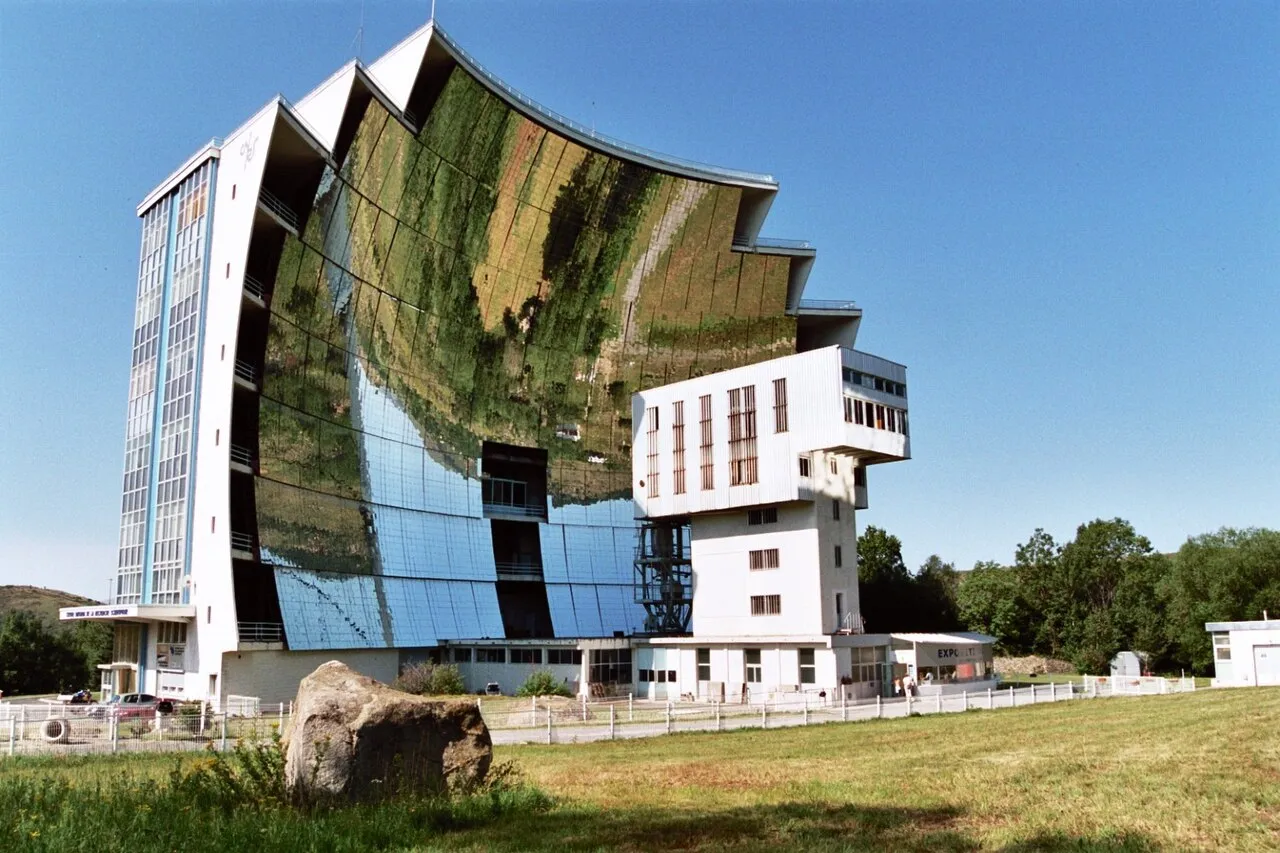 The large mirrored facade of the Odeillo solar furnace in France